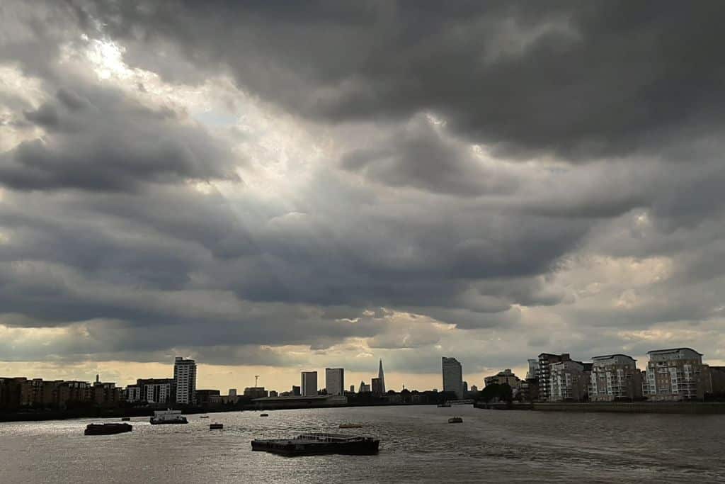 Moody looking grey clouds over the River Thames in London.