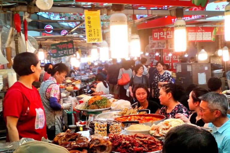 A typically bustling scene of customers deciding what to eat at Gwangjang Market.