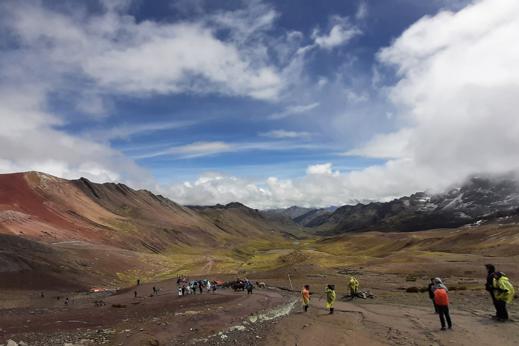 The clouds parted, and blue skies appeared on my hike to Rainbow Mountain.