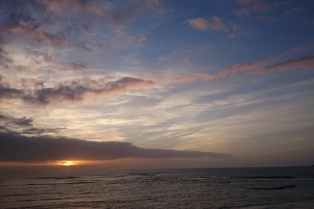 A glorious skyline as the sun sets over the ocean in Cadiz, Spain.